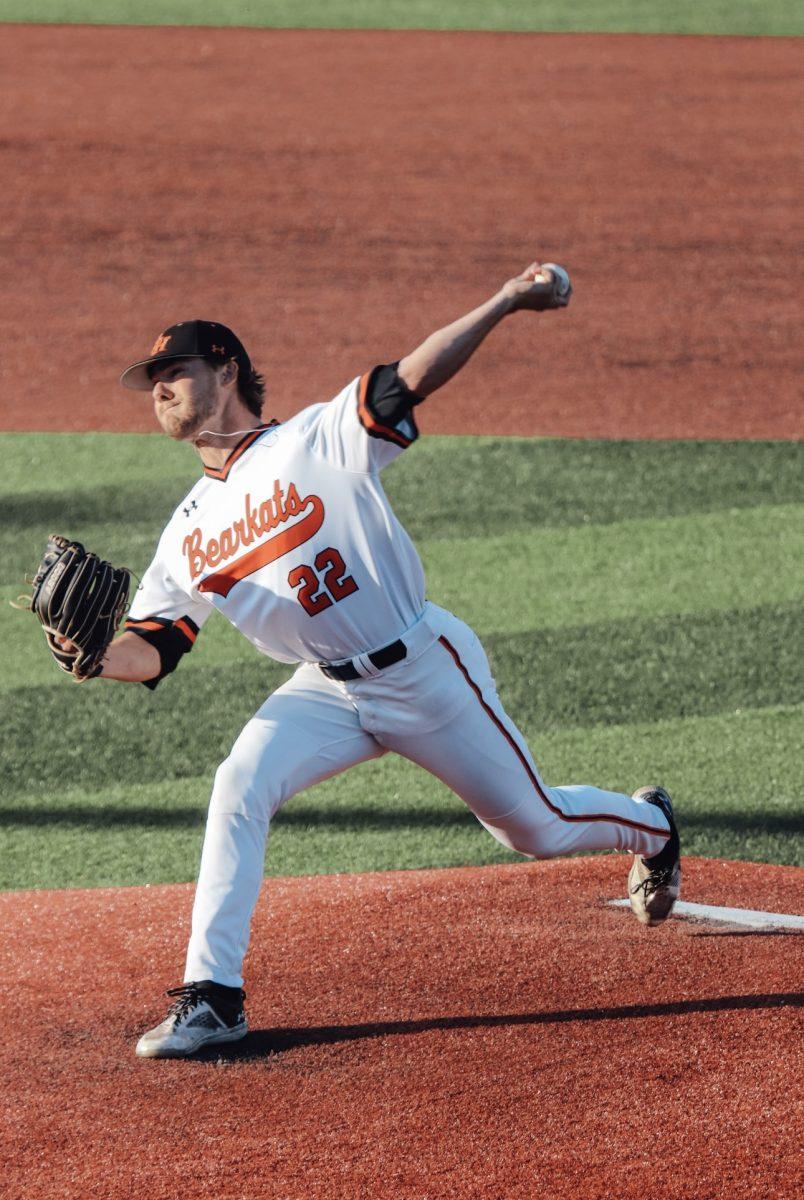 Marshall Wales delivers a powerful pitch, showcasing his skills on the mound.