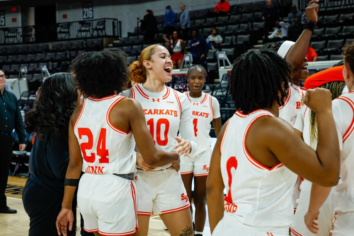 The Sam Houston women's basketball team celebrates after defeating Jacksonville State in the first round of the Conference USA tournament on Tuesday in Huntsville, Alabama.