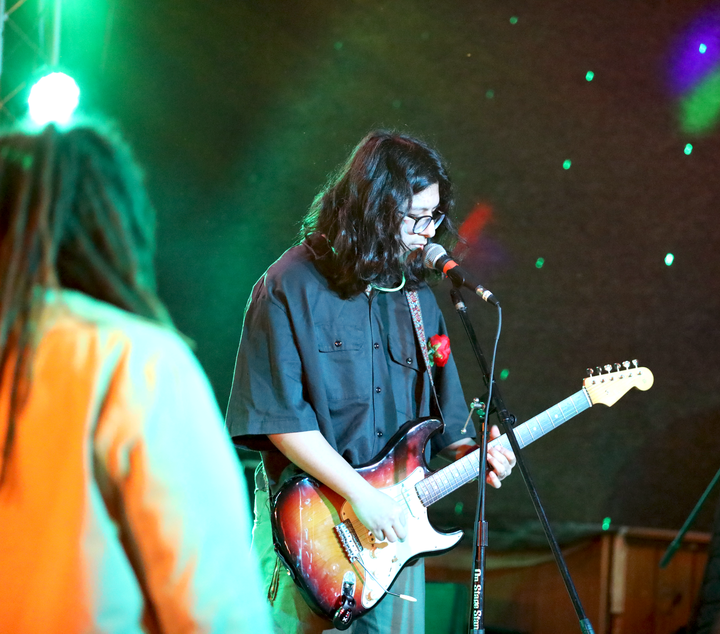 Michael Coleman, guitarist for Coaxial Wake, performing on stage at 12th Street Bar.
