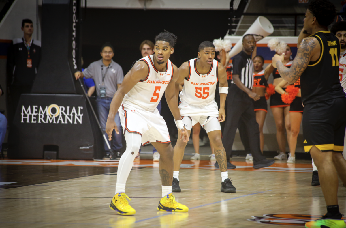 Sam Houston guards Justin Begg (5) and Jacob Walker (55) get set on defense during Wednesday's win over Kennesaw State at Johnson Coliseum.