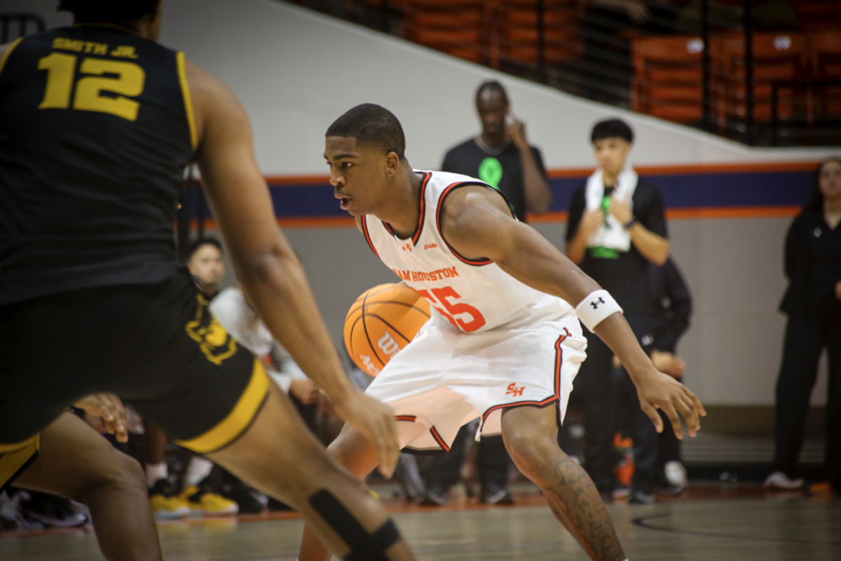 Sam Houston freshman guard Jacob Walker assesses the defense during a home win over Kennesaw State on Jan. 21.