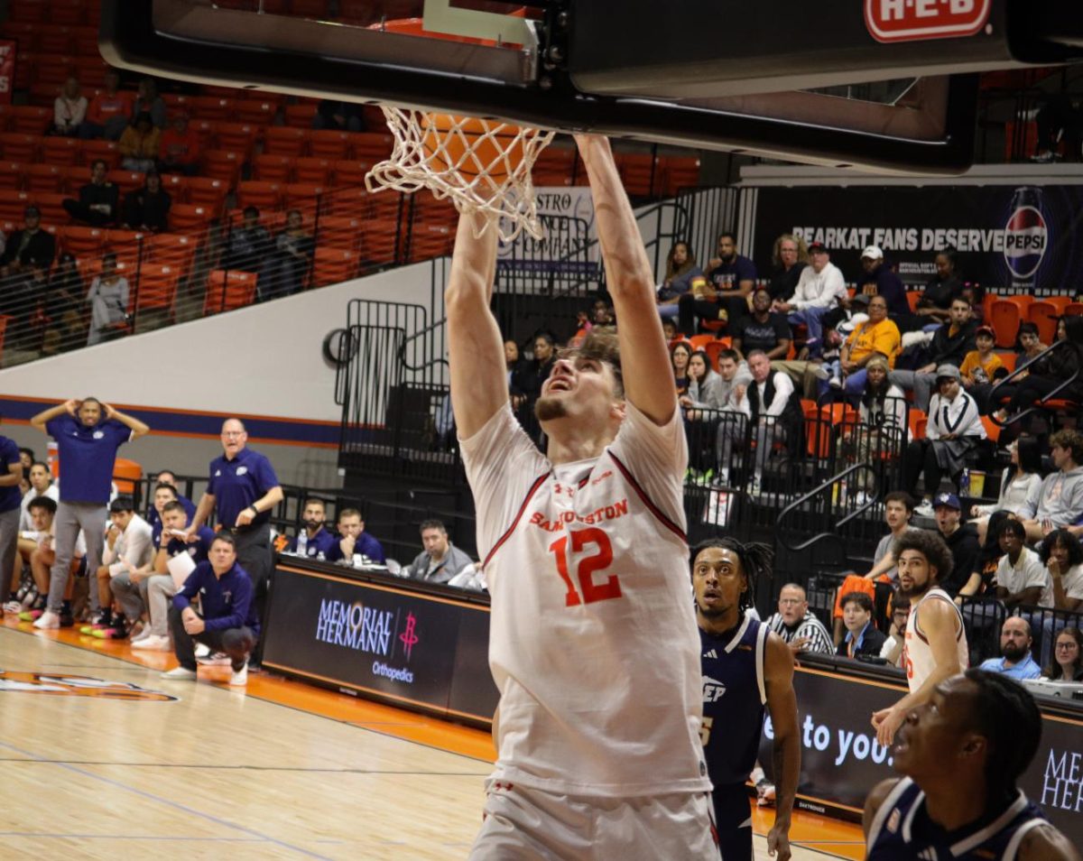 Freshman forward Matt Dann throws down a dunk, shifting momentum in the Bearkats’ victory over UTEP on Wednesday night.