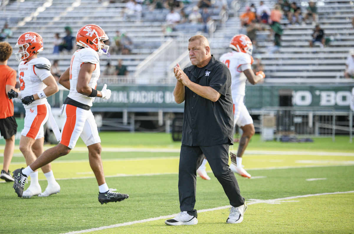 Sam Houston head football coach Phil Longo walks on the field prior to a game at Hawaii during the 2025 season.