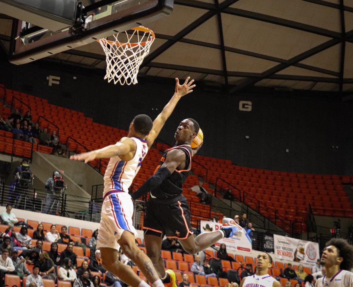 Sam Houston guard Kashie Natt dunks over a defender to seal the Bearkats’ win over Louisiana Tech on Saturday night. Natt grabbed 11 rebounds in the victory. 